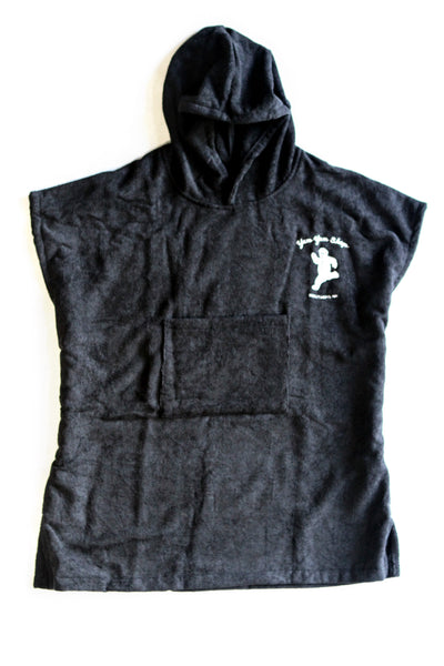 A dark blue grey towel poncho with hood and the Yum Yum Shop logo printed in the upper corner.